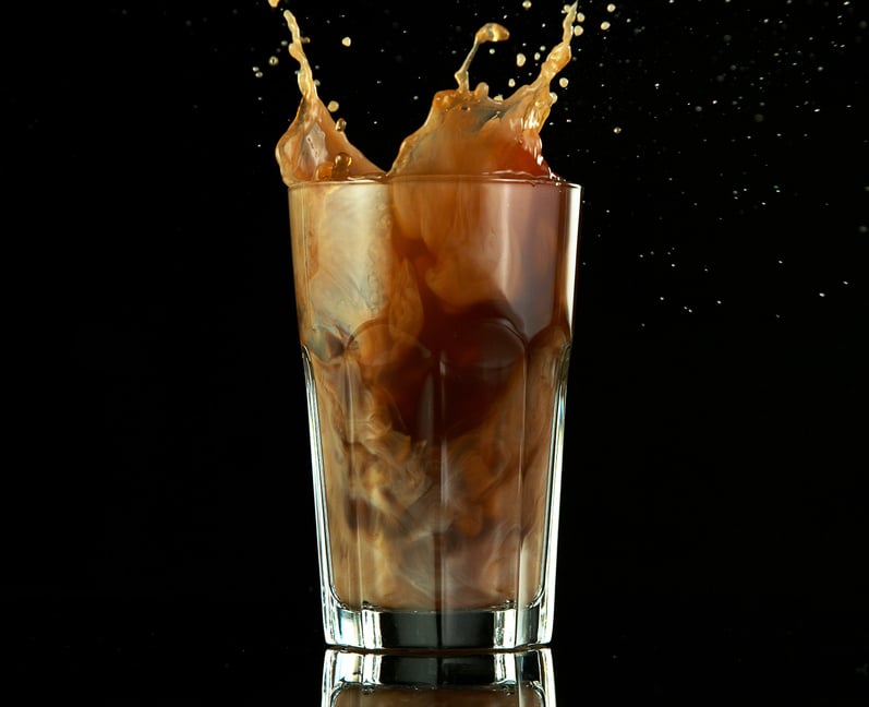 Splashing Ice Coffee Drink on Black Background